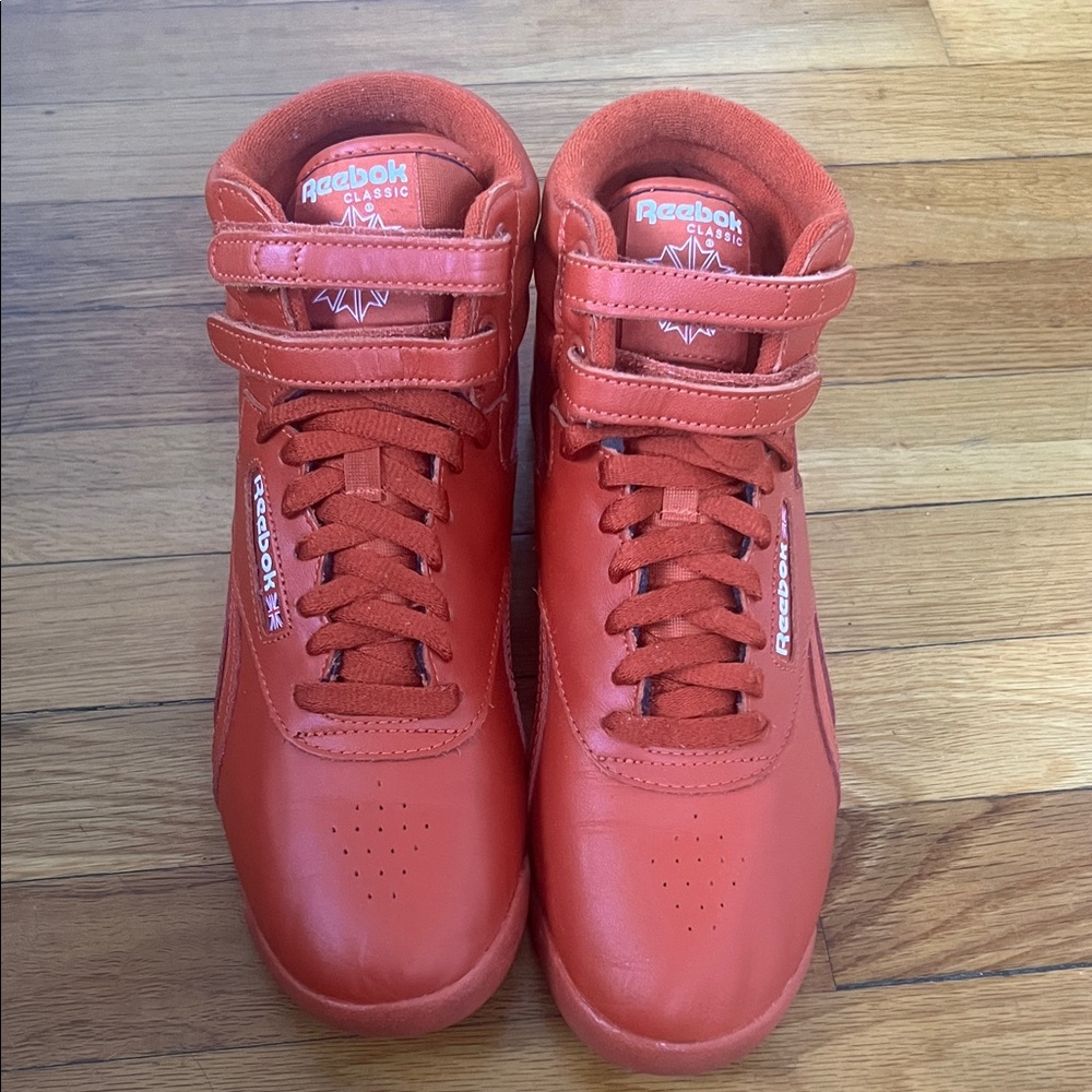 Reebok Freestyle Hi High-Top Sneakers in Burnt Orange